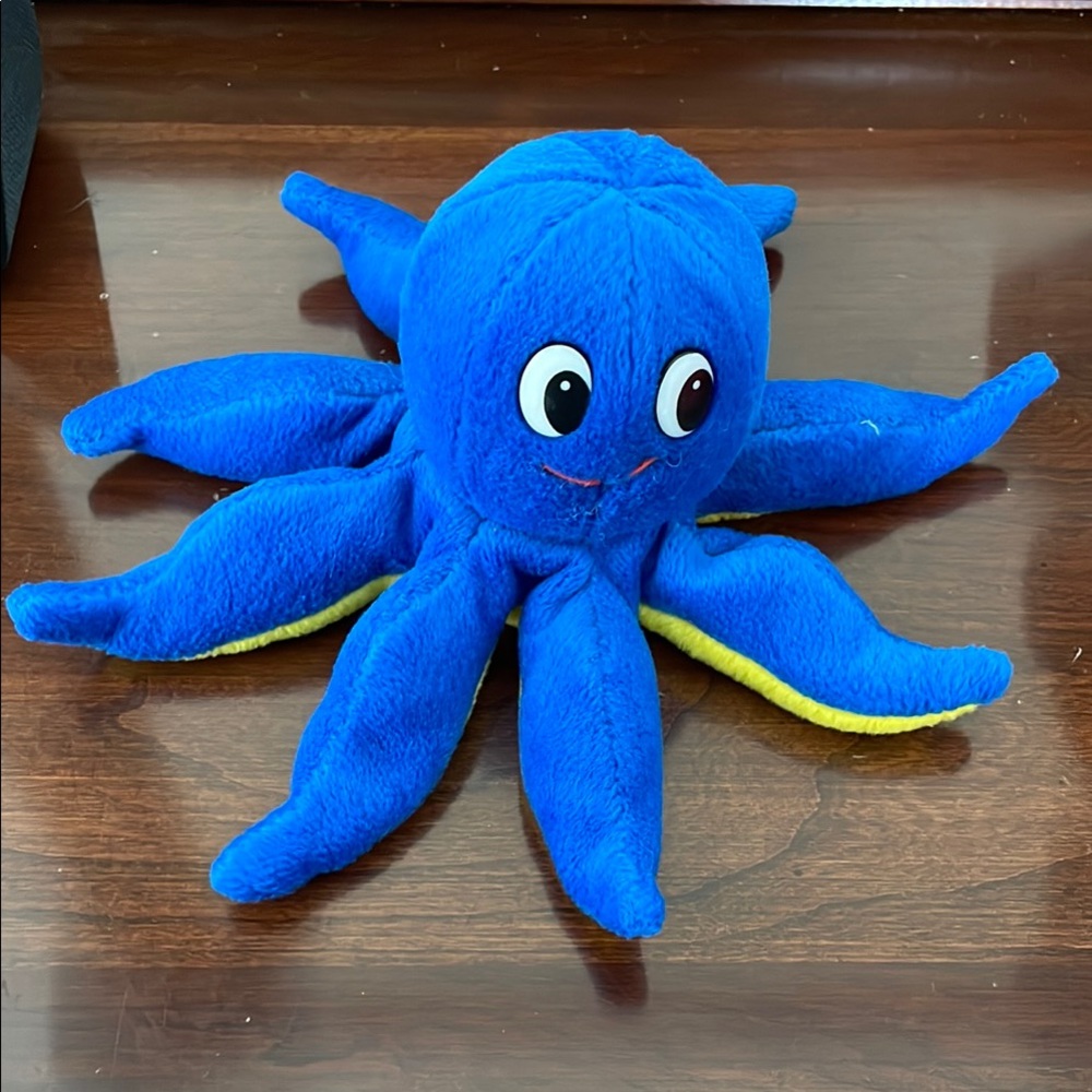 Blue and Yellow Stuffed Octopus with Cartoon Eyes